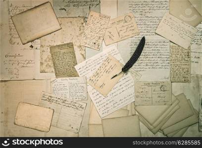 ephemera. old letters, handwritings, vintage postcards and antique feather pen. nostalgic sentimental textured background