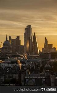 Epic landscape cityscape skyline image of London in England during colorful Autumn Fall sunrise