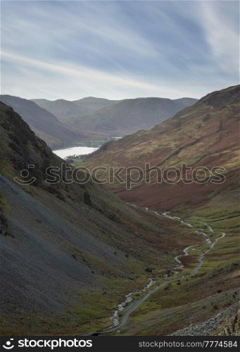Epic landscape image of view down Honister Pass to Buttermere from Dale Head in Lake District during Autumn sunset