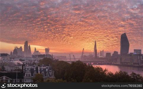 Epic sunrise over London city skyline with stunning sky formations over iconic landmarks