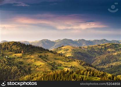 Epic sunset in the mountains after storm. Colorful evening in Alps. Alpine evening scene.