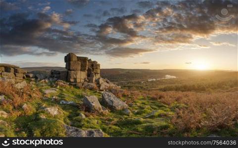 Epic sunset over landscape of Leather Tor in Dartmoor during Summer with dramatic sky