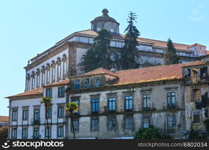 Episcopal Palace (former residence of bishops of Porto) and old house in front, Portugal. Built in 12th or 13th century, rebuilding in 18th century by architect Nicolau Nasoni.