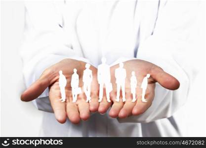 Equality of people. Close up of human hands with row of people figures