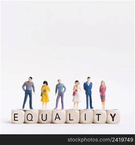 equality written wooden cubes people