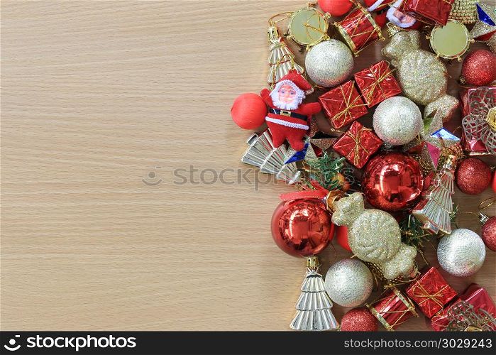 Equipment Christmas decorations are placed on a brown wooden flo. Equipment Christmas decorations are placed on a brown wooden floor and have copy space to input ideas of your work.
