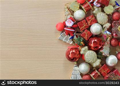 Equipment Christmas decorations are placed on a brown wooden flo. Equipment Christmas decorations are placed on a brown wooden floor and have copy space to input ideas of your work.
