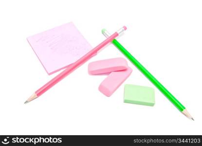 erasers, pencils and sticky note on white background