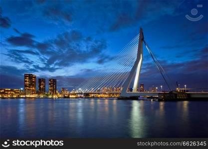 Erasmus Bridge (Erasmusbrug) and Rotterdam skyline illuminated at night. Rotterdam, Netherlands. Erasmus Bridge, Rotterdam, Netherlands