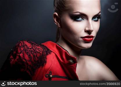 erotic blonde sexy woman in red jacket with red lips
