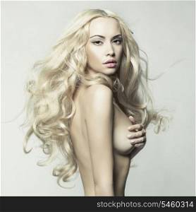 Erotic portrait of nude beautiful woman. Sexy blonde.