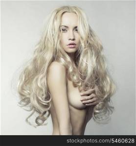Erotic portrait of nude beautiful woman. Sexy blonde.