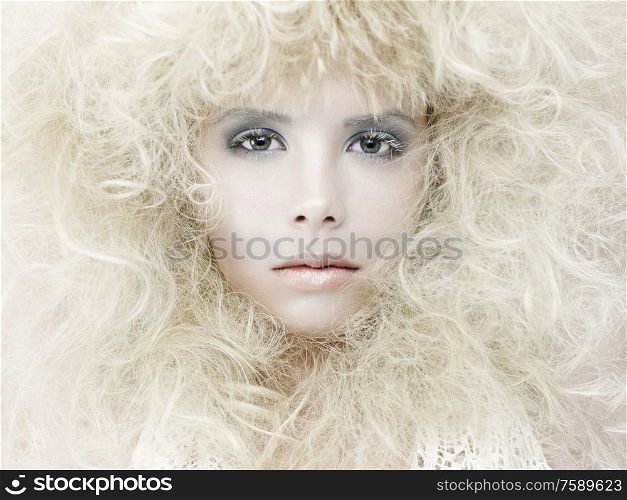 Erotic portrait of young beautiful woman. Sexy blonde with fashionable makeup. Lady with stylish hairstyle. Studio photography of pretty model.