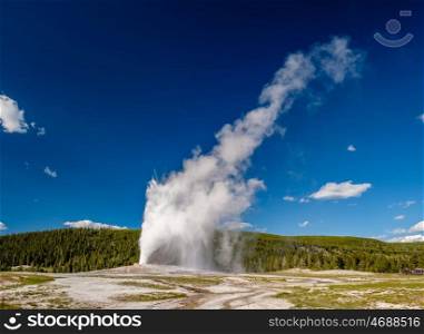 Eruption of Old Faithful geyser in Yellowstone National Park, Wyoming, USA