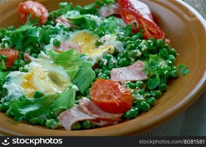 Ervilhas com ovos Stewed peas with poached eggs.Portuguese cuisine