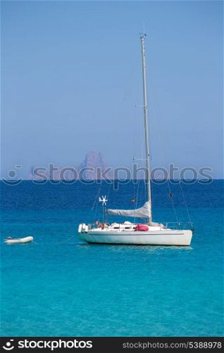 Es Vedra Ibiza background with sailboat from Formentera in Balearic Islands