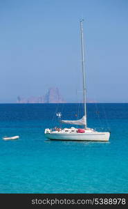 Es Vedra Ibiza background with sailboat from Formentera in Balearic Islands