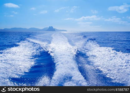 Es Vedra islet and Vedranell islands with boat wake in mediterranean Spain