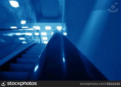 escalator transportation motion blured business background