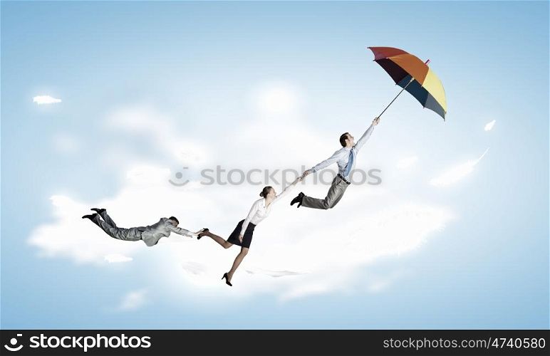 Escape from office. Business people flying in the sky on umbrella