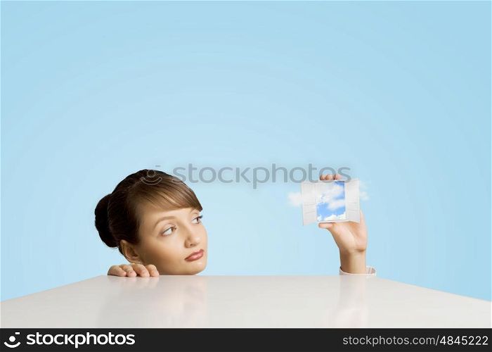 Escaping from reality. Conceptual image of woman looking in opened door