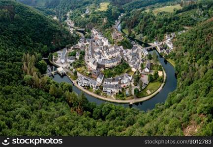 Esch-sur-Sure, Luxembourg - 4 June, 2022: drone view of the picturesque village of Esch-sur-Sure on the Sauer River in northern Luxembourg