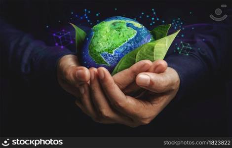 ESG Concept. Nature Meet Technology. Green Energy, Renewable and Sustainable Resources. Environmental and Ecology Care. Hand Embracing Green Leaf and Globe
