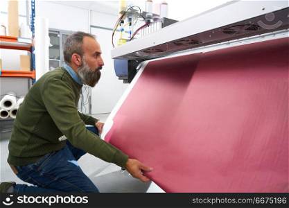 Espertise man in transfer printing industry plotter. Espertise man in transfer printing industry plotter printer hipster beard