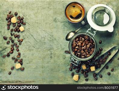 Espresso and coffee beans on vintage background