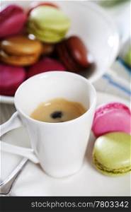 Espresso and fresh colorful macaroons