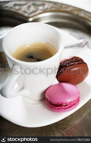Espresso and fresh colorful macaroons