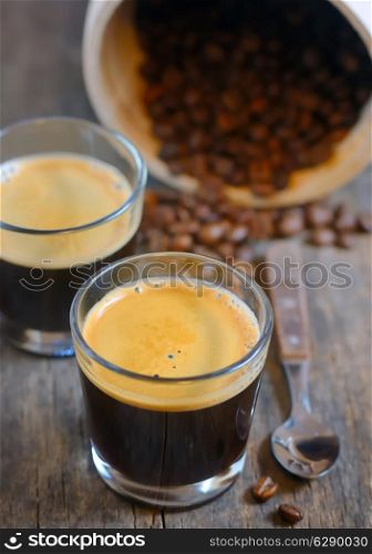 Espresso and Roasted steaming coffee beans