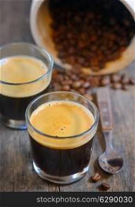 Espresso and Roasted steaming coffee beans