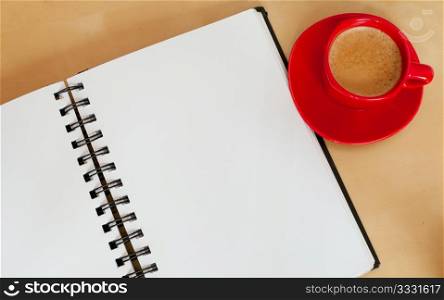 Espresso Coffee and Blank Paper Notebook on Wooden Table