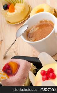espresso coffee and fruit cream cake pastry closeup