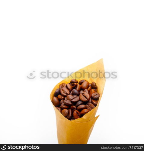 espresso coffee beans on a paper cone cornucopia over white background