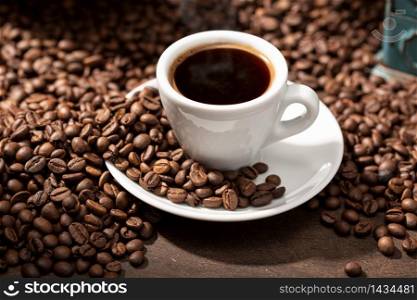 Espresso Coffee cup and roasted beans. Coffee background