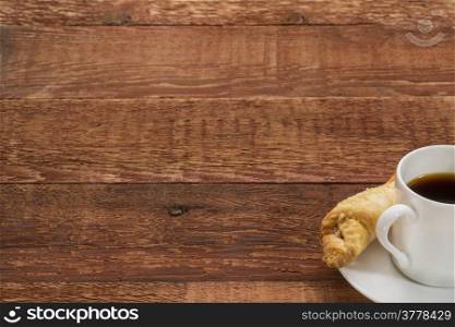 espresso coffee cup with a cookie on a rustic barn wood table - copy space