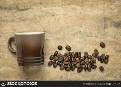 espresso coffee cup with coffee bean against handmade bark paper with a copy space