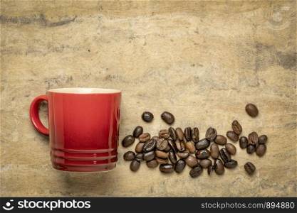 espresso coffee cup with coffee bean against handmade bark paper with a copy space