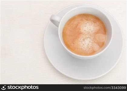 Espresso Coffee in White Cup on Light Tablecloth