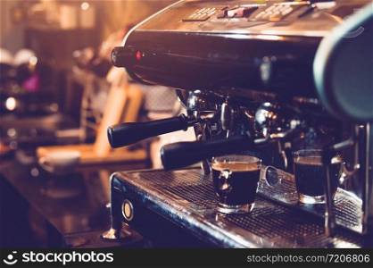 Espresso coffee maker machine working in pub and restaurant bar background. Business food and drinks concept.
