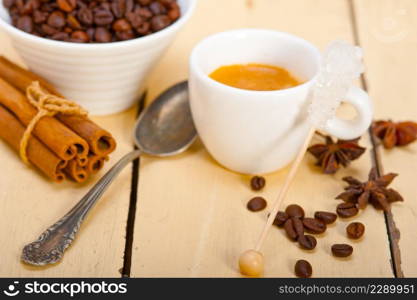 espresso coffee over white wood rustic table with sugar and spice