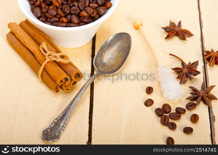 espresso coffee over white wood rustic table with sugar and spice