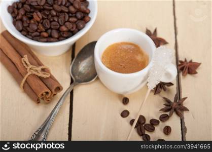 espresso coffee over white wood rustic table with sugar and spice