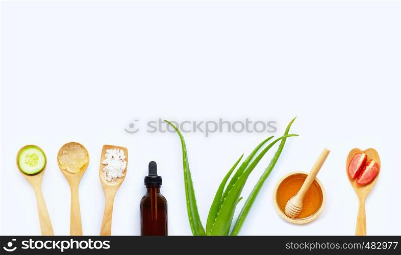 Essential oil, Aloe vera, lemon, salt, honey. Natural ingredients for homemade skin care on white