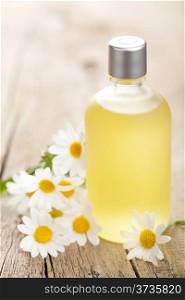 essential oil and chamomile flowers
