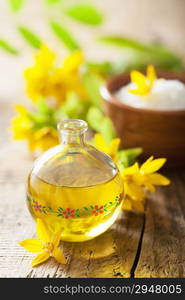 essential oil and yellow flowers for spa