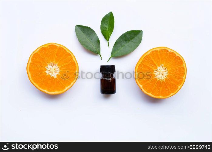 Essential oil of orange on white background.