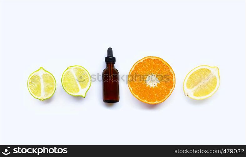 Essential oil with citrus tropical fruit isolated on white background
